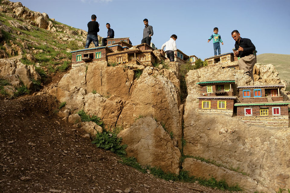 Tourists atop a miniature village in Sulaimani. The Kurds are a traditional mountain people, with more than 30 million of them spread throughout Iran, Iraq, Turkey, Syria, and Central Asia.