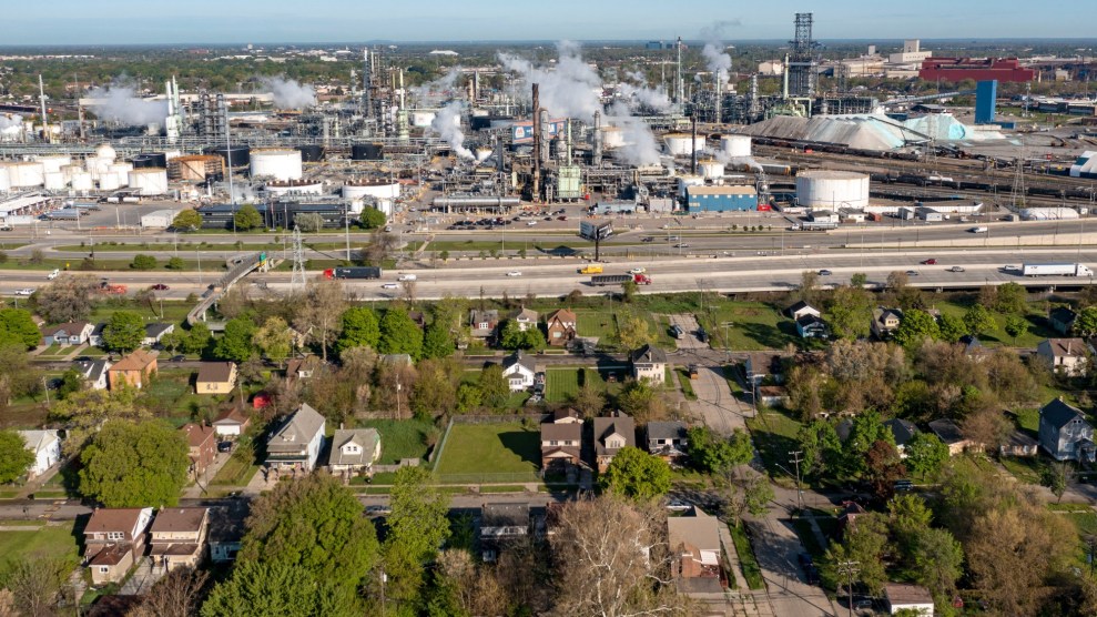 Refinery spewing smoke sit across from a neighborhood in Detroit