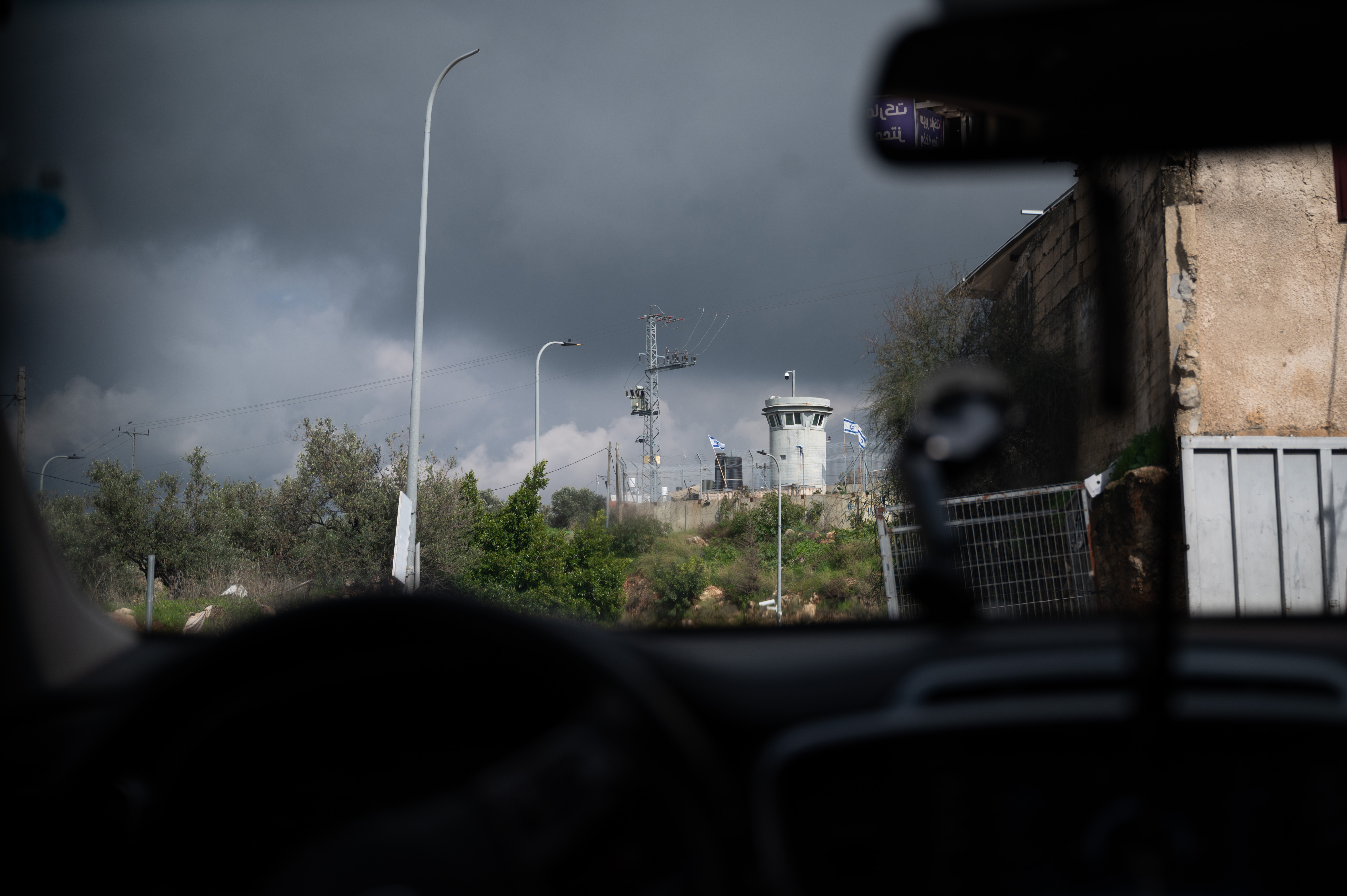 View of a watchtower from inside a car.