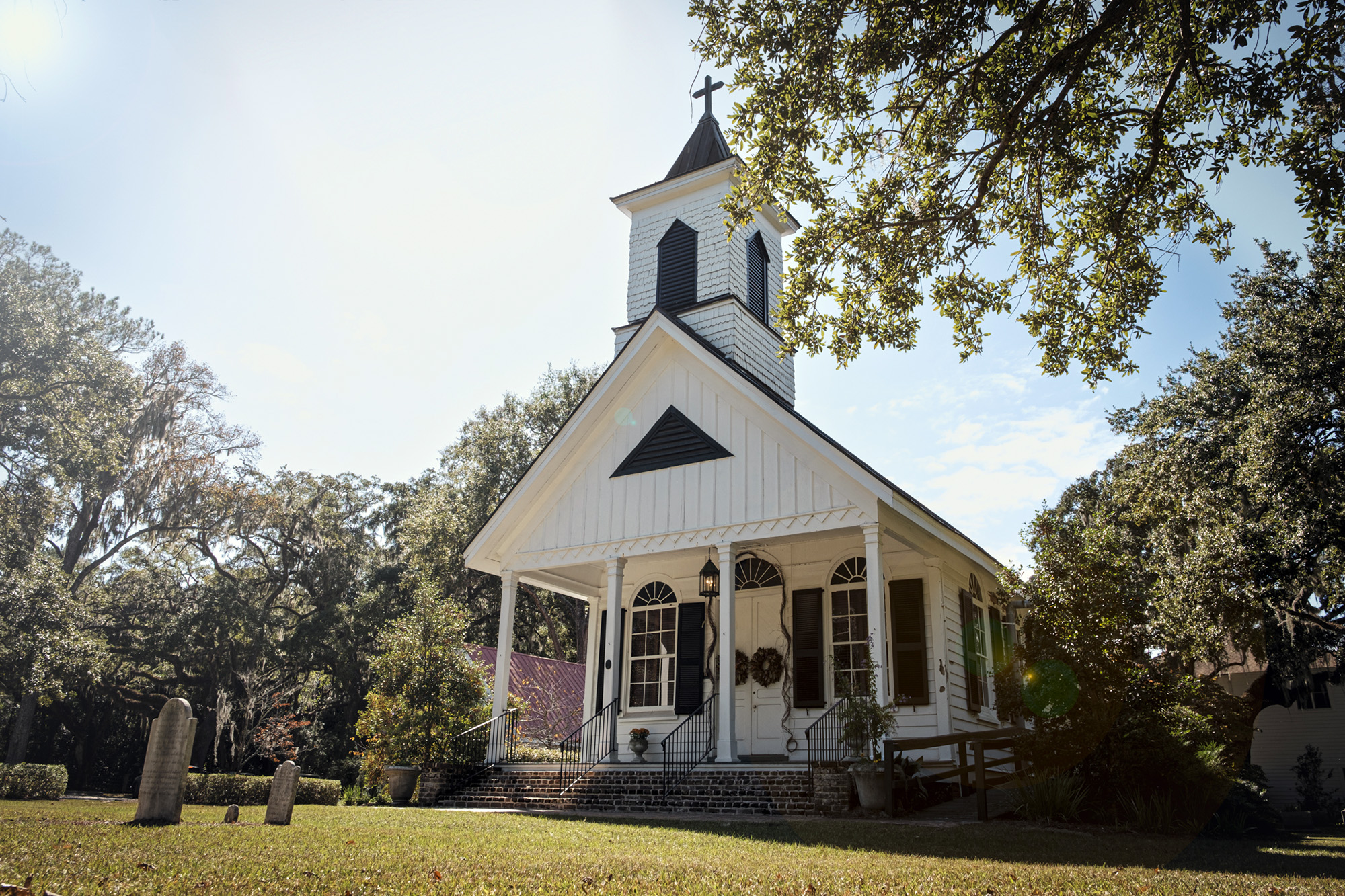 A small church with tombstones in front