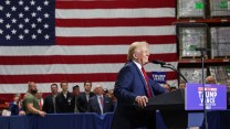 A photo of former President Donald Trump in front of an American Flag