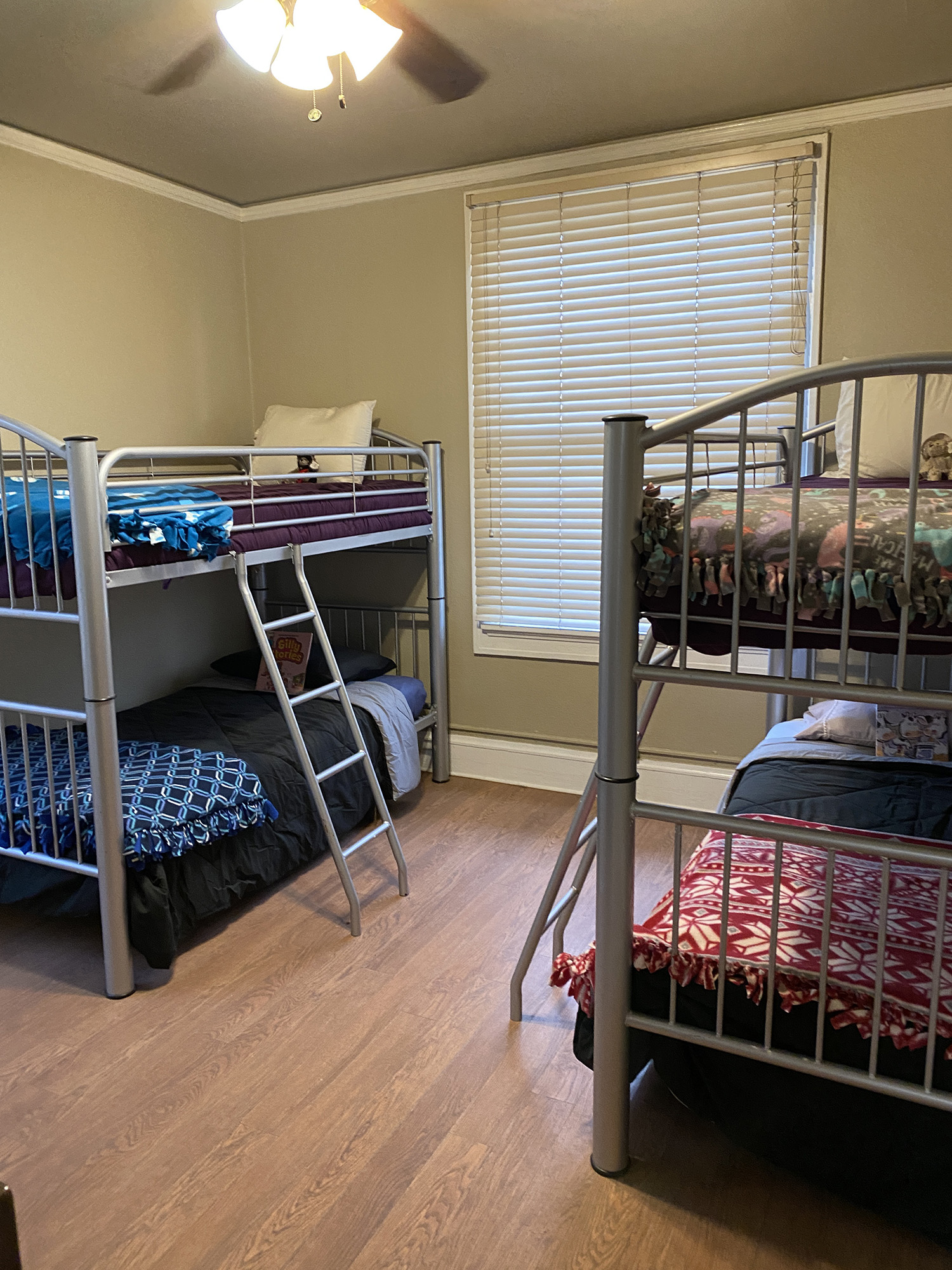 Room with two sets of bunk beds.