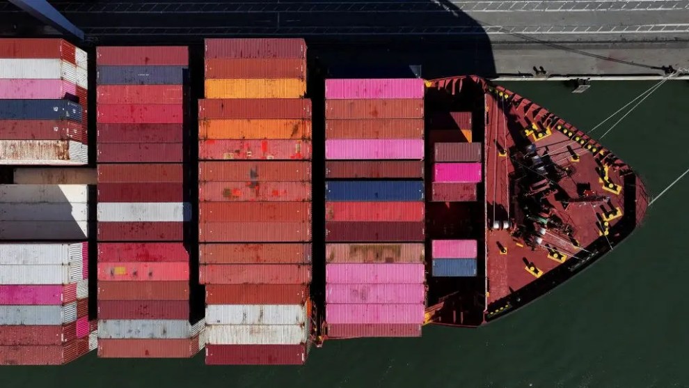 Shipping containers on a large ship from above.