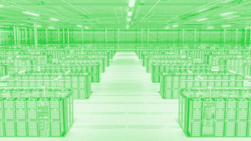 A green tinted computer data center full of server racks