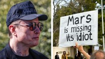 A man wearing a black hat and a sign that says "Mars is missing its idiot"