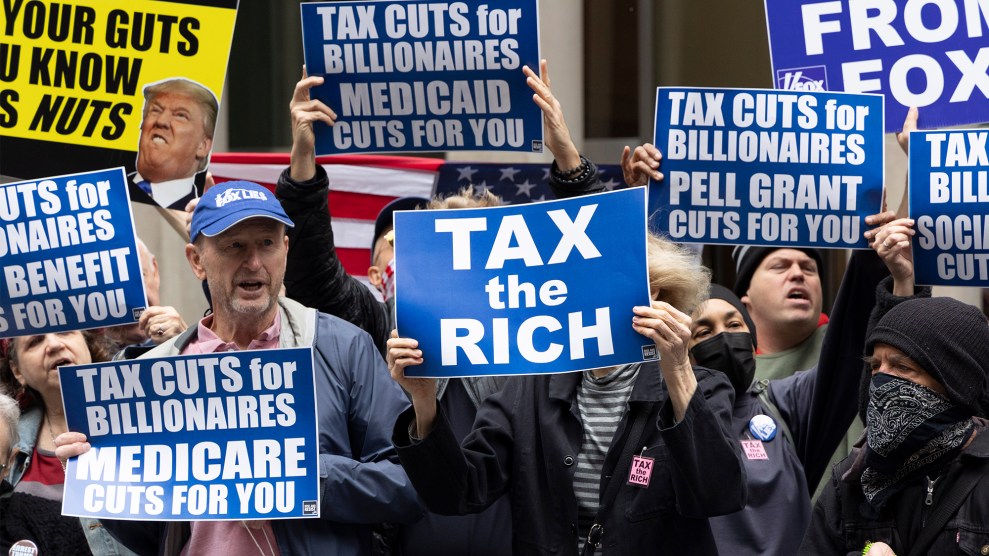 Demonstrators hold signs that read 'TAX the RICH' 'TAX CUTS FOR BILLIONAIRES MEDICARE CUTS FOR YOU' 'TAX CUTS FOR BILLIONAIRES MEDICAID CUTS FOR YOU' 'TAX CUTS FOR BILLIONAIRES PELL GRANT CUTS FOR YOU'