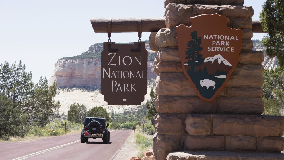 A car driving into Zion National Park
