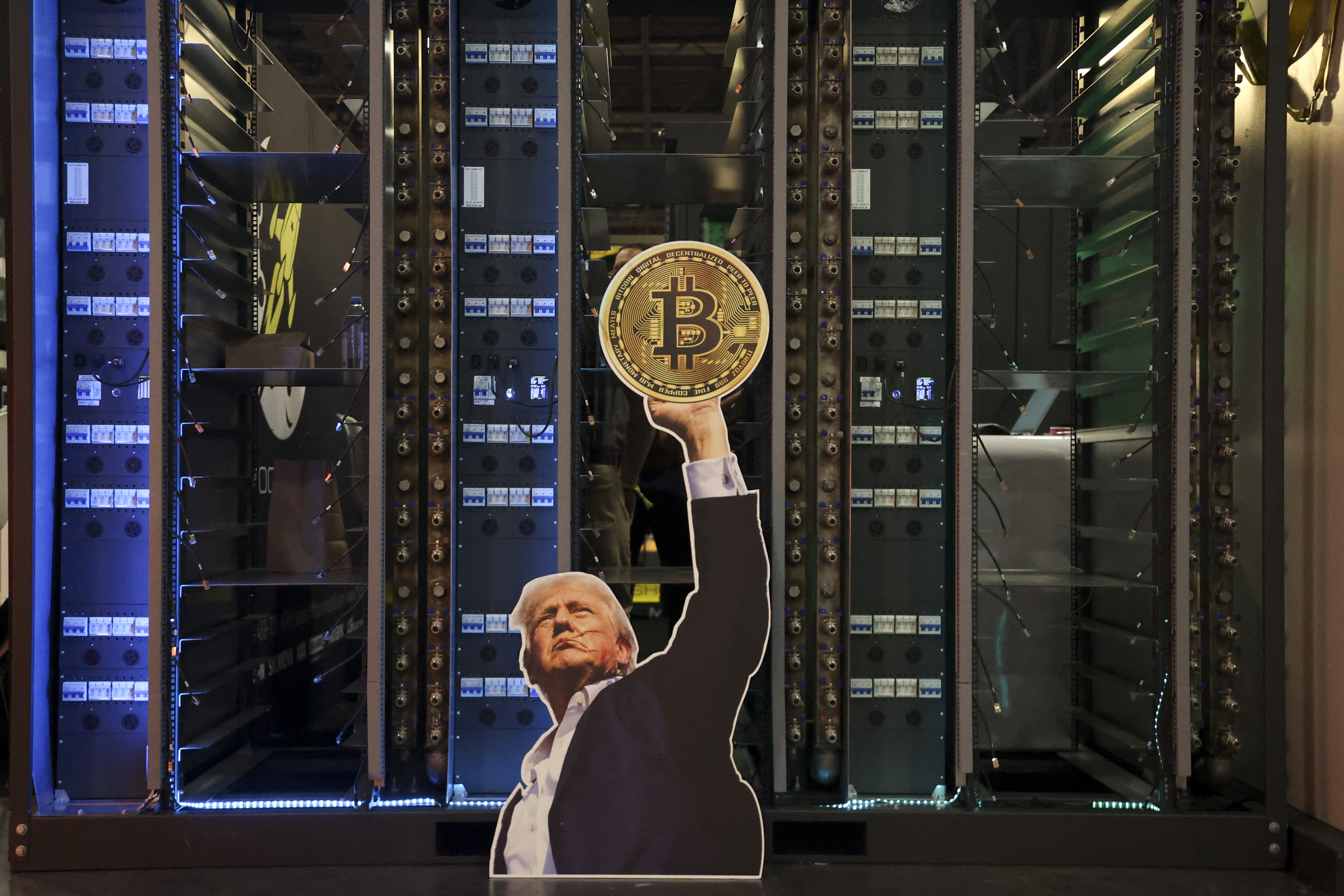 A cutout of US President Donald Trump holding a bitcoin 