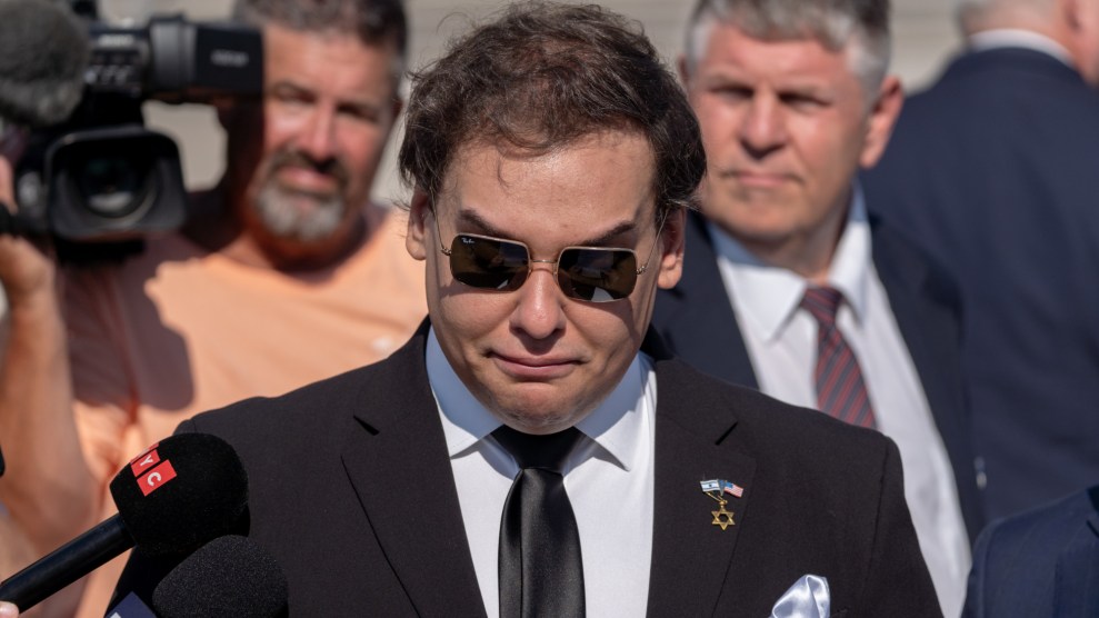 George Santos wearing Ray-Ban sunglasses and looking miserable after a court hearing on Long Island.