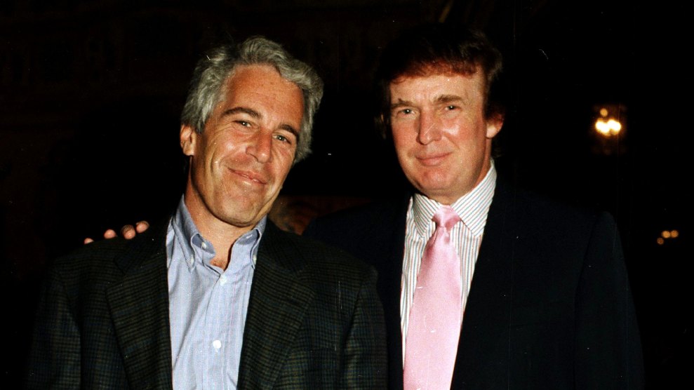 Smirking Jeffrey Epstein and Donald Trump pose in 1997 at Mar-a-Lago, Trump's arem around Epstein's shoulder, both in dark jackets with button-down shirts, Trump has a wide pink tie.