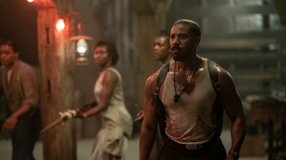 Michael B. Jordan wearing a white tank top with three Black actors behind him