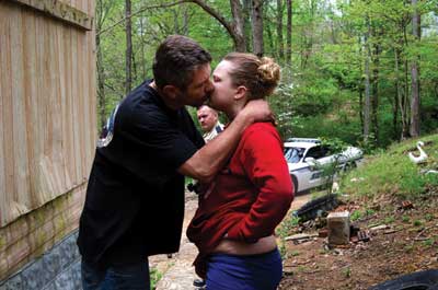 A man and a woman kissing