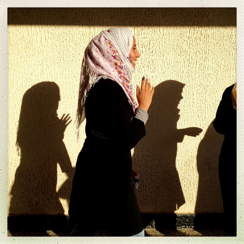 Women wait in line to vote in the first free Libyan elections in decades in Benghazi, Libya.