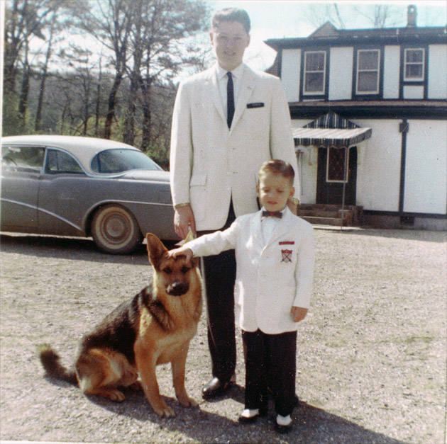 Bill and Roger Clinton with their dog, King, in front of their house on Park Avenue in Hot Springs, Arkansas, on Easter Sunday, 1962.